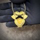 Brass pendant "Cherubic Charm" with red crystal